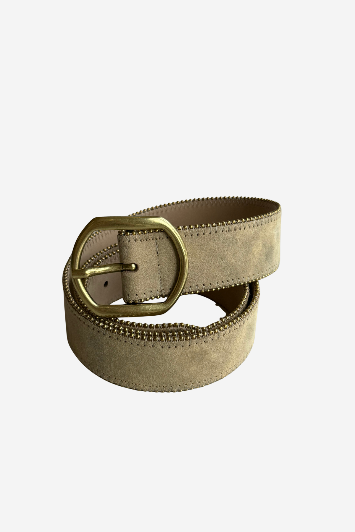 A light beige suede belt with a prominent gold-tone metal buckle, coiled on a plain light gray background.