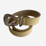 A light tan leather belt with a silver-tone metal buckle, neatly coiled on a light gray background.