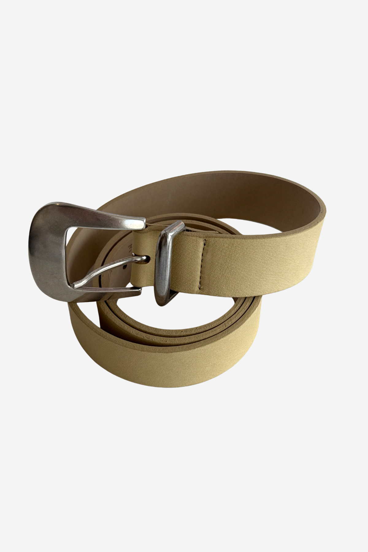 A light tan leather belt with a silver-tone metal buckle, neatly coiled on a light gray background.