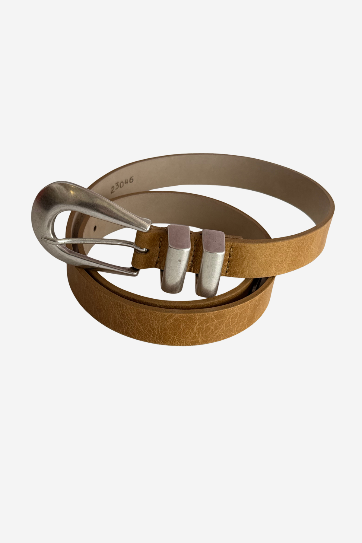 A tan leather belt with a textured finish and a silver-tone metal buckle, coiled on a light gray background.
