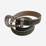 Green colored belt with silver trim on plain white background