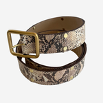 Snake patterned belt on plain white background