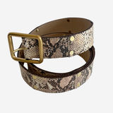 Snake patterned belt on plain white background