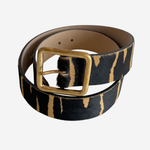 Zebra printed belt with gold buckle on plain white background