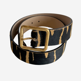 Zebra printed belt with gold buckle on plain white background
