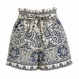 Patterned shorts with a belt on a white background