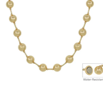A gold-toned beaded necklace with round pearl-like beads connected by small metallic links, shown on a plain white background. A small inset in the lower right shows a water-resistant detail with the text 'Water-Resistant.
