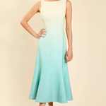 Woman wearing a gradient dress with a beige background