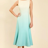Woman wearing a gradient dress with a beige background