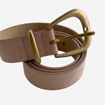 Dusty pink colored belt on plain white background