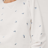 Rails Tiffany white sweatshirt with small embroidered floral motifs and relaxed fit.