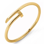 A polished gold-tone open cuff bangle bracelet with a geometric, stylized bar design, shown on a clean white background.