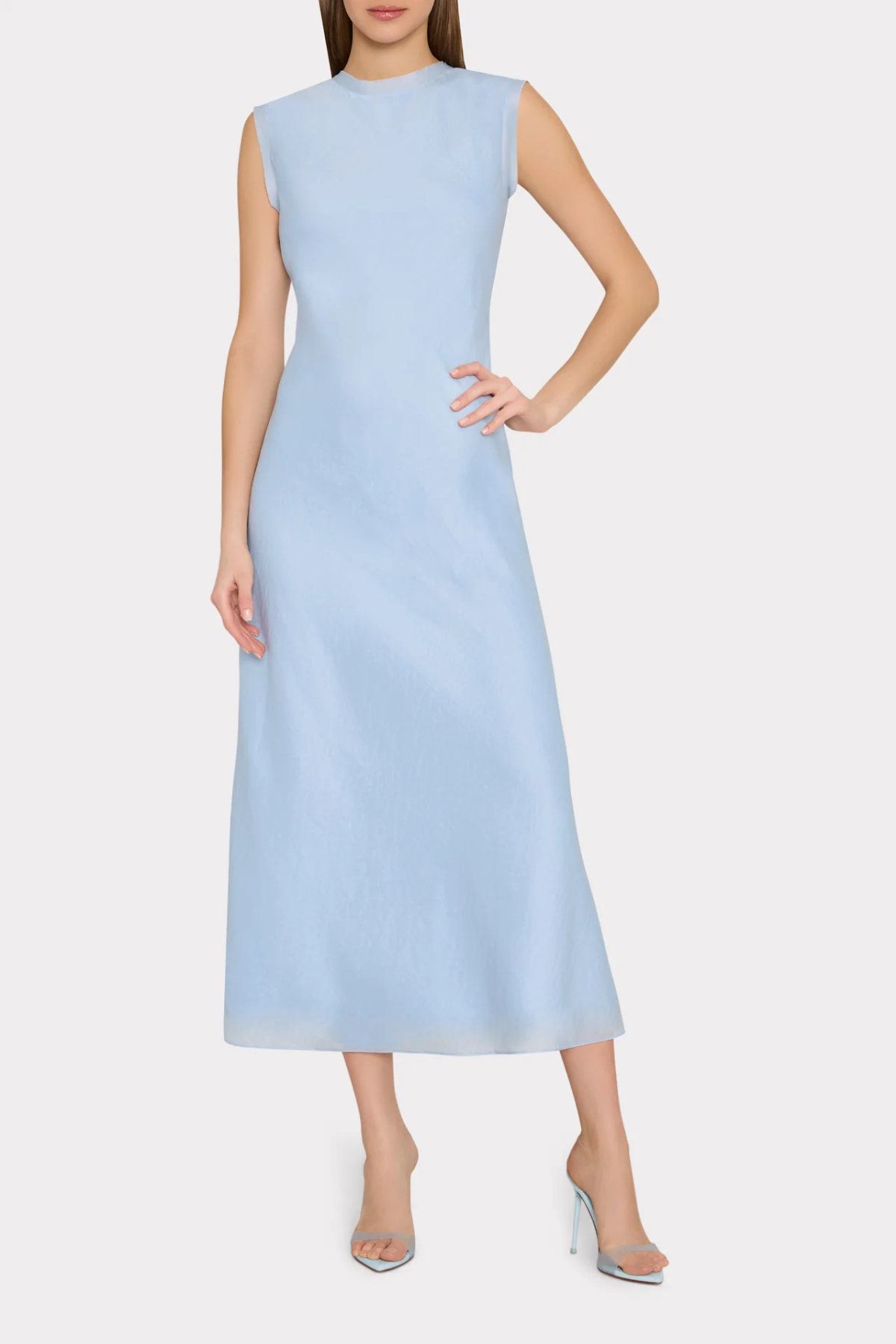 Light blue sleeveless dress worn by a model on a white background