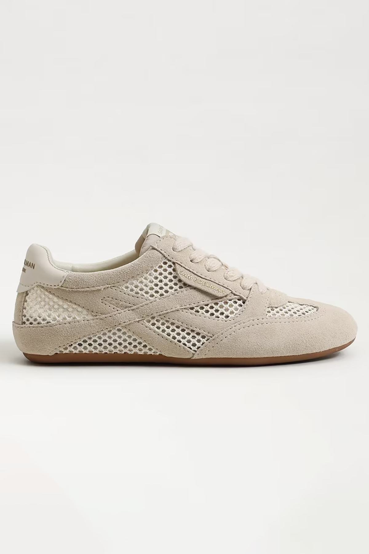 Beige sneaker with perforated design on a white background
