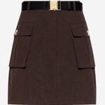 A dark brown mini skirt with a black belt featuring a gold-tone buckle, detailed with two front flap pockets on the sides.