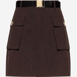 A dark brown mini skirt with a black belt featuring a gold-tone buckle, detailed with two front flap pockets on the sides.