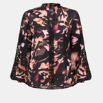 Floral patterned blouse on a white background