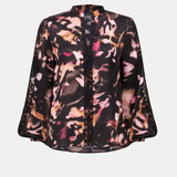 Floral patterned blouse on a white background