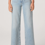 Light blue jeans worn by a person on a white background