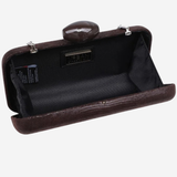 A dark brown textured clutch bag shown open, revealing a black interior lining and a small oval mirror attached to the top clasp. The brand name 'JERSEY' is visible on a small black label inside the lining.