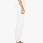 White pants worn by a person on a white background
