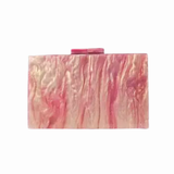 marbled pink clutch against a white background