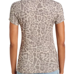 A woman viewed from the back wearing a short-sleeve crewneck t-shirt with a beige and gray leopard print, paired with light blue jeans, against a plain white background.