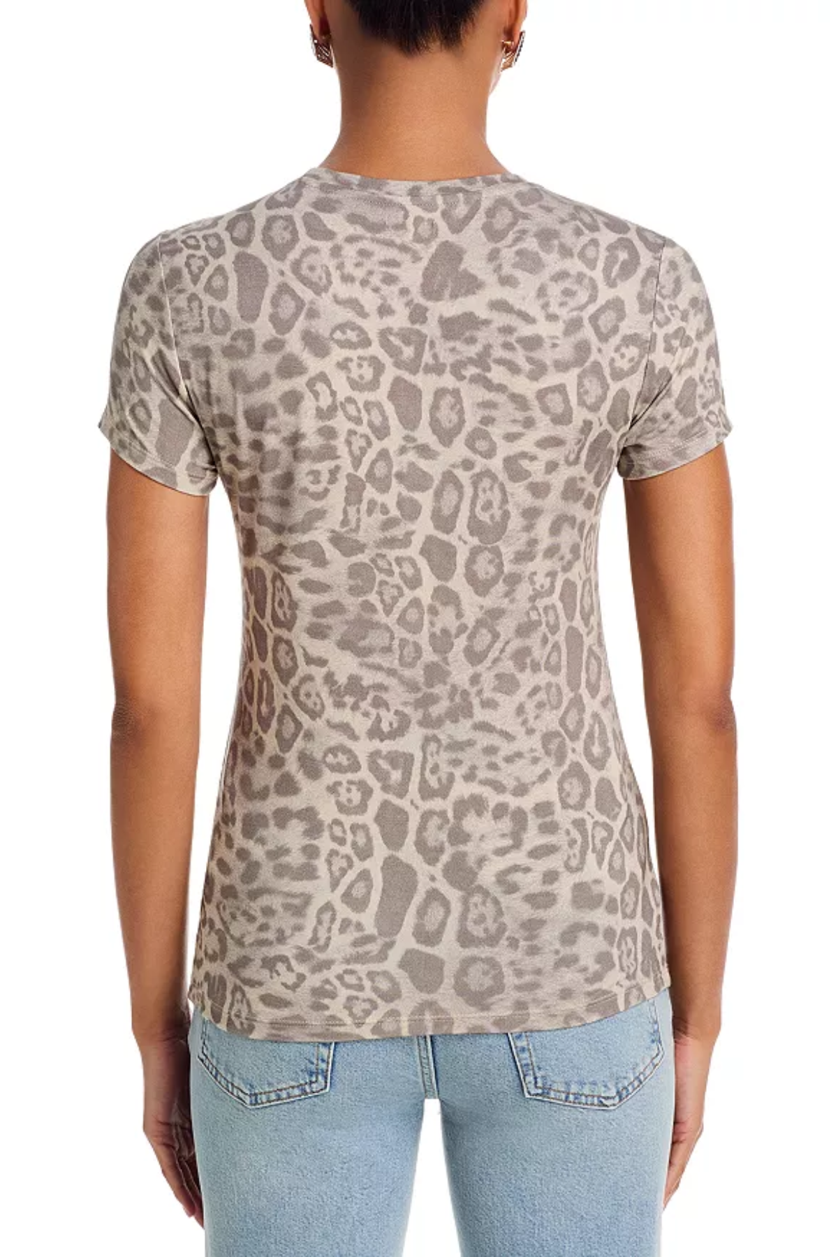 A woman viewed from the back wearing a short-sleeve crewneck t-shirt with a beige and gray leopard print, paired with light blue jeans, against a plain white background.