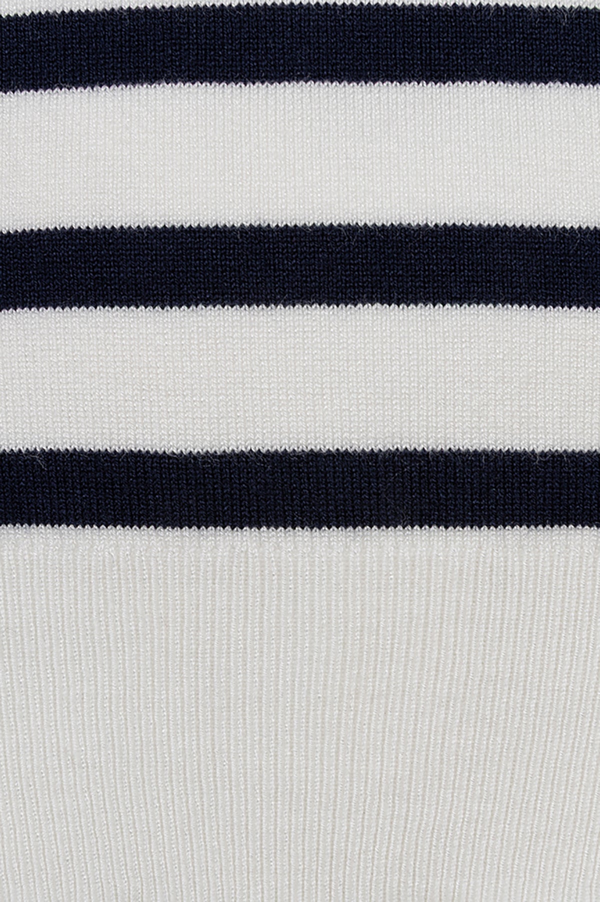 Close-up of a white fabric with black horizontal stripes