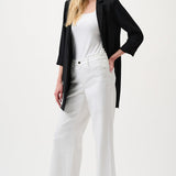 White wide-leg stretch denim jeans with high-rise fit.