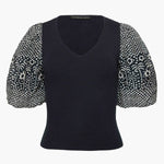 Black short-sleeve top with a clean neckline and soft drape