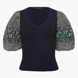 Black short-sleeve top with a clean neckline and soft drape