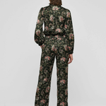Women's printed style featuring an earthy multicolor pattern and feminine silhouette.