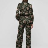 Women's printed style featuring an earthy multicolor pattern and feminine silhouette.