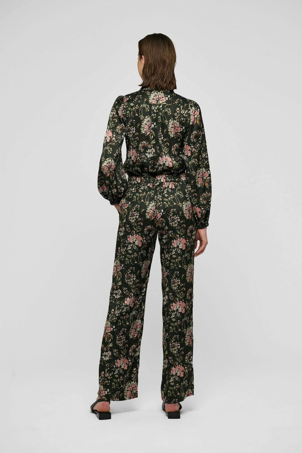 Women's printed style featuring an earthy multicolor pattern and feminine silhouette.