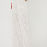 White wide-leg pants worn by a person on a white background