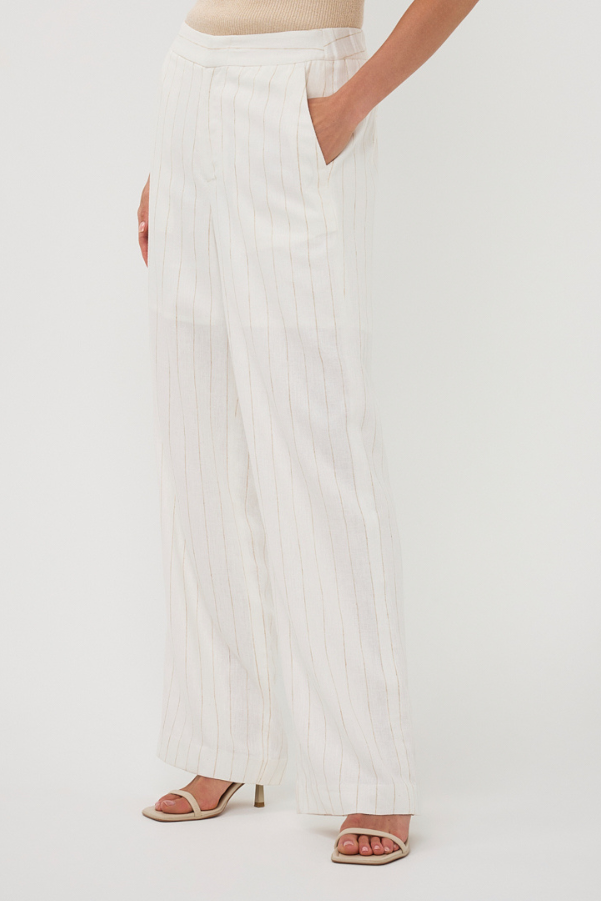 White wide-leg pants worn by a person on a white background