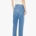 Person wearing blue jeans and a white top on a white background