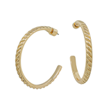 Gold hoop earrings on a white background