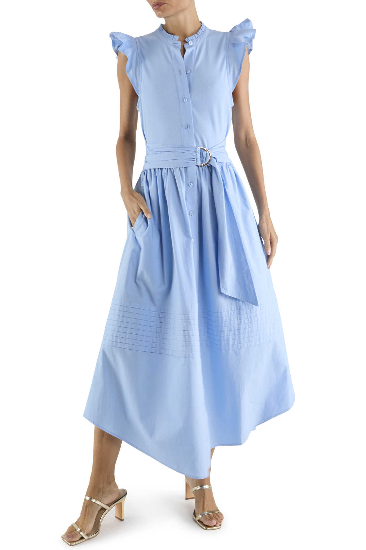 Woman wearing a light blue dress with ruffled sleeves on a white background