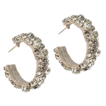 Pair of gold hoop earrings with embedded stones on a white background
