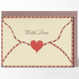 A square greeting card with a cream center and a red-and-white striped border, featuring a red heart and the words 'With Love' in script. A matching brown envelope is placed behind the card on a light gray background.