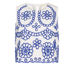 White sleeveless top with blue floral patterns on a white background