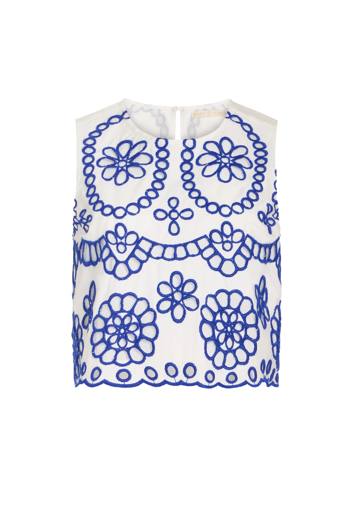 White sleeveless top with blue floral patterns on a white background