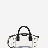 A clear transparent PVC handbag with black leather handles and trim, featuring gold-tone metal studs and a small black brand plaque on the front.