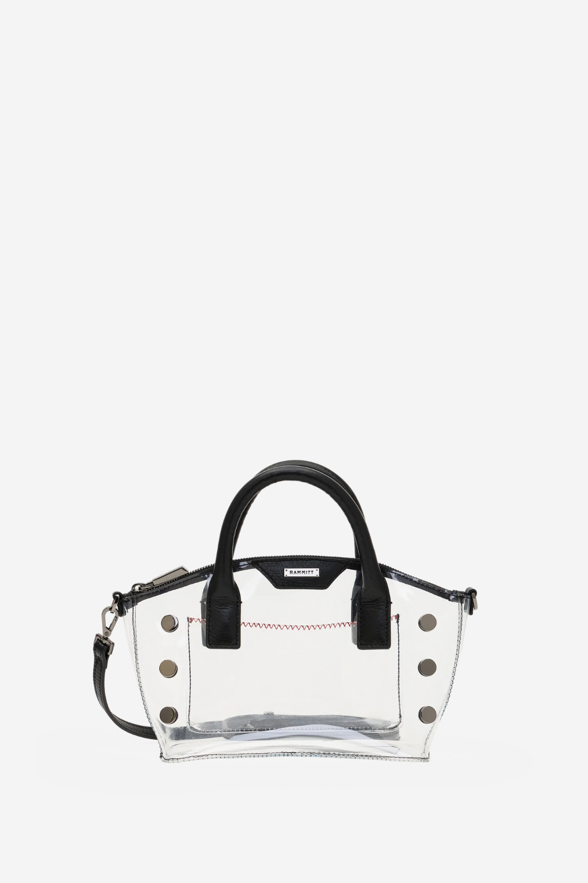 A clear transparent PVC handbag with black leather handles and trim, featuring gold-tone metal studs and a small black brand plaque on the front.