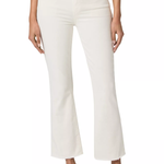 A model wearing a pair of off-white cropped flare jeans with a silver button closure, paired with a white top and tan espadrille mules, shown against a plain white background.