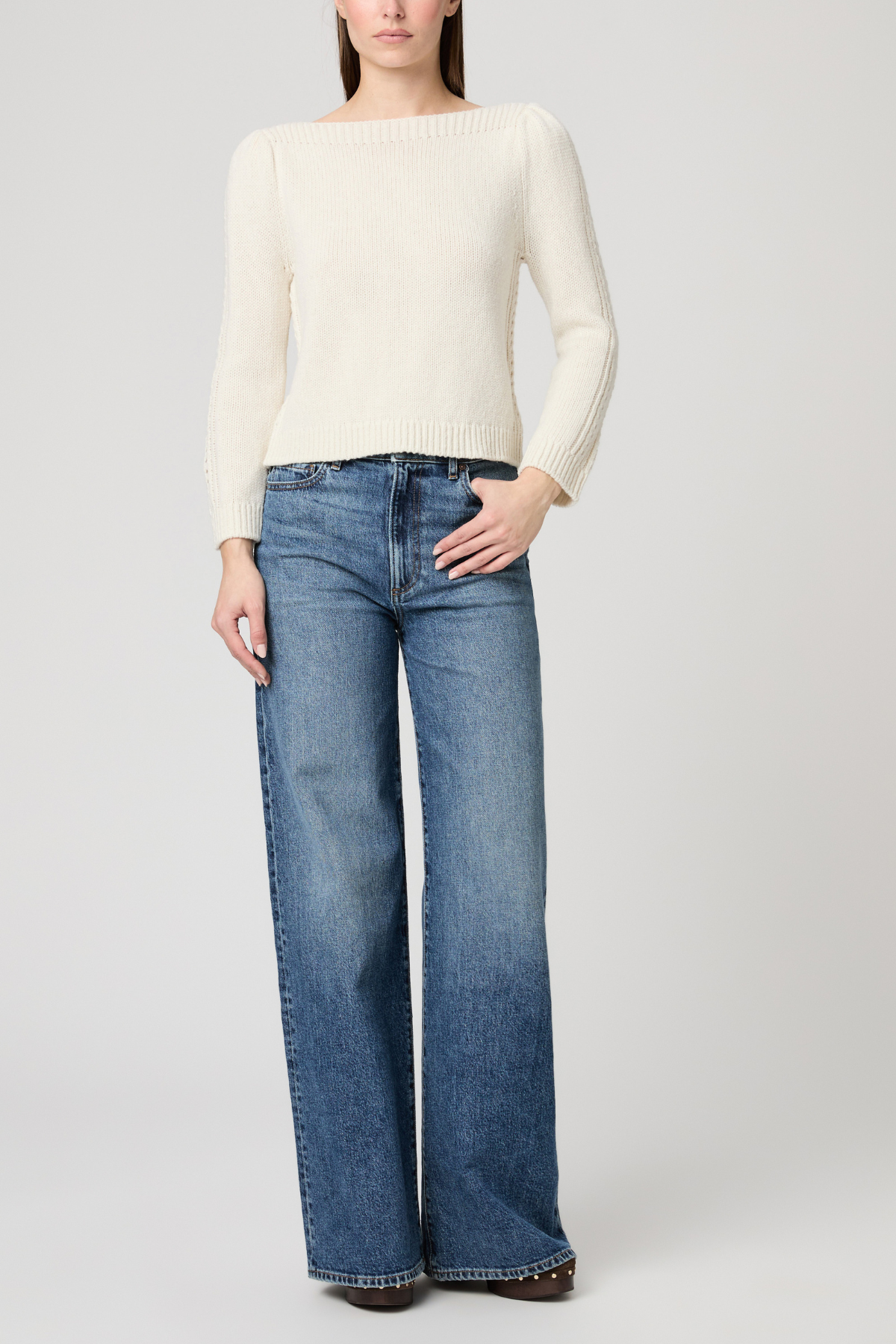 Women's ivory sweater featuring long sleeves, a classic neckline, and relaxed silhouette.