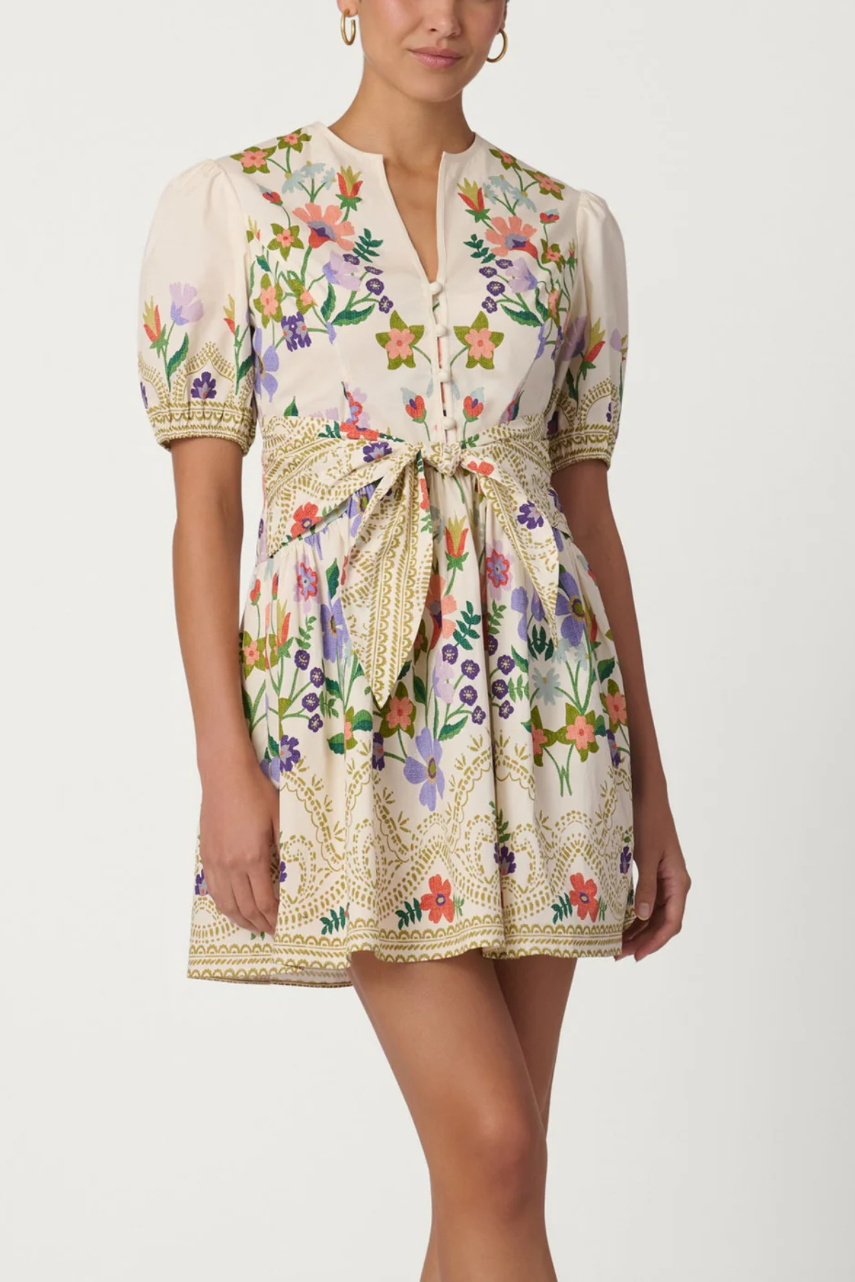 Woman wearing a floral dress with a white background