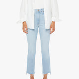 Person wearing a white shirt, light blue jeans, and pink sandals on a white background